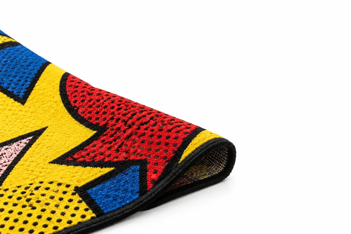 Détail graphique et texture d’un tapis pop art aux couleurs vives